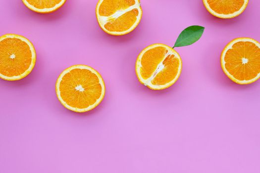 High vitamin C, Juicy and sweet. Fresh orange fruit on pink background.