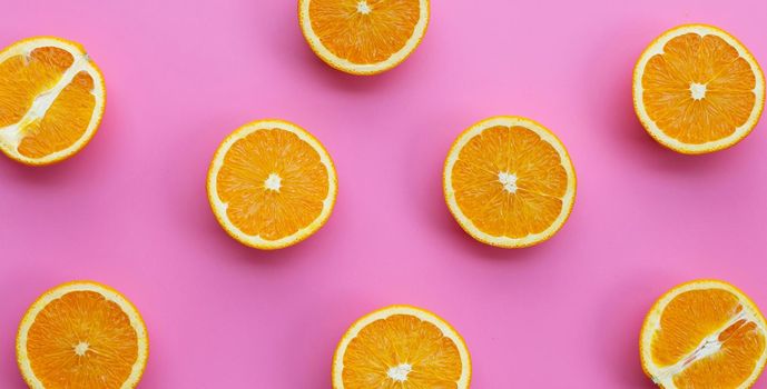 High vitamin C, Juicy and sweet. Fresh orange fruit on pink background.