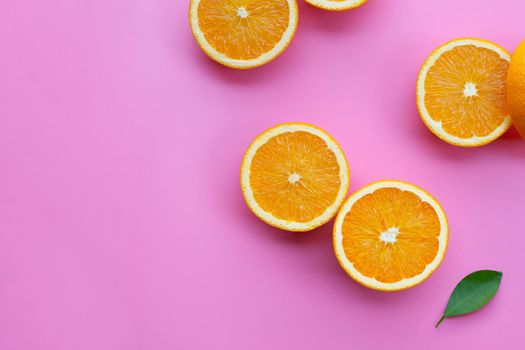 High vitamin C, Juicy and sweet. Fresh orange fruit on pink background.