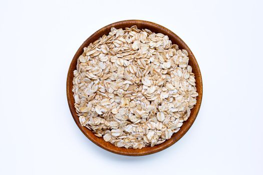 Oat flakes in bowl on white background. Healthy food concept