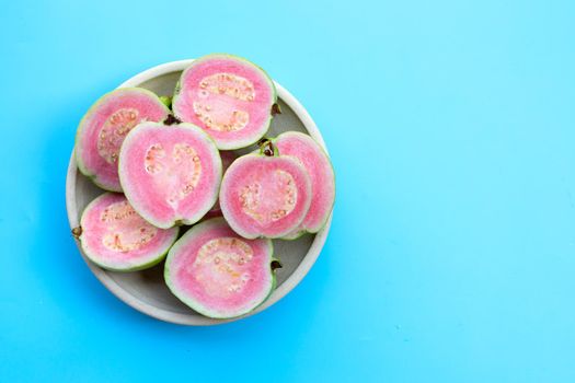 Pink guava on blue background.