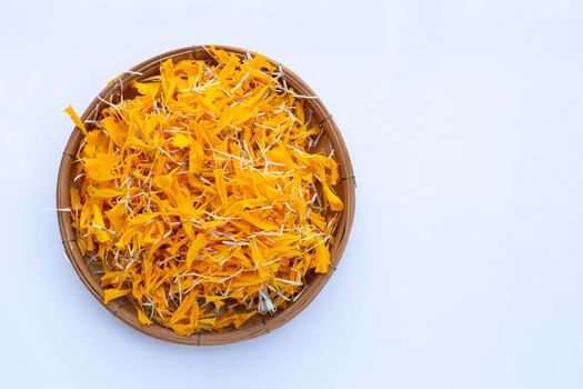 Petals of marigold flower on white background.