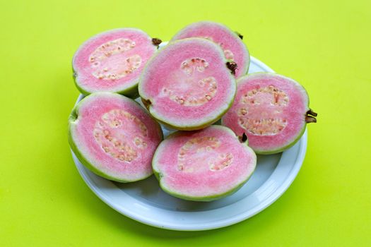Pink guava on green background.