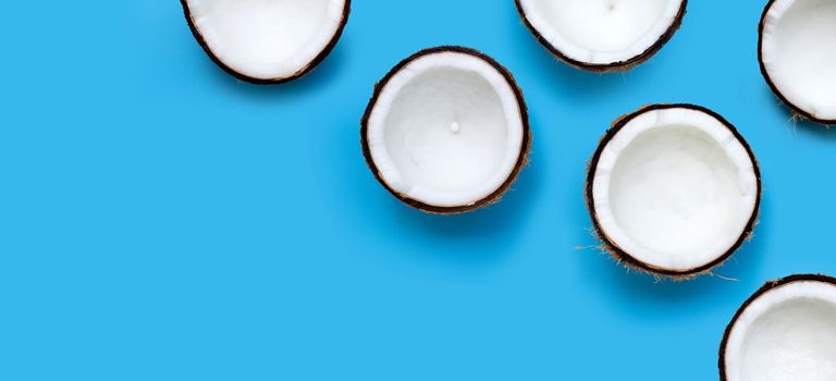 Coconuts on blue background. Top View