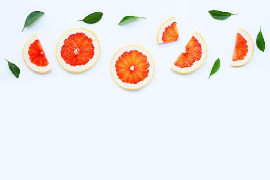 High vitamin C. Juicy grapefruit slices on white background.