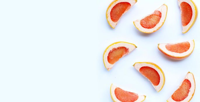 High vitamin C. Juicy grapefruit slices on white background.