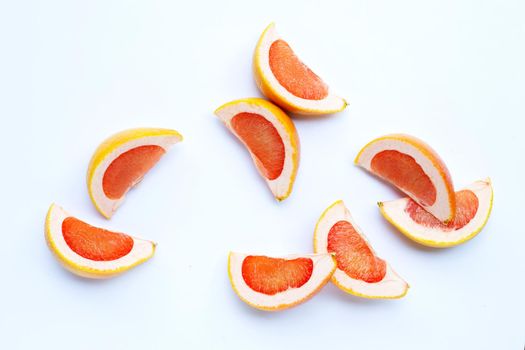 High vitamin C. Juicy grapefruit slices on white background.