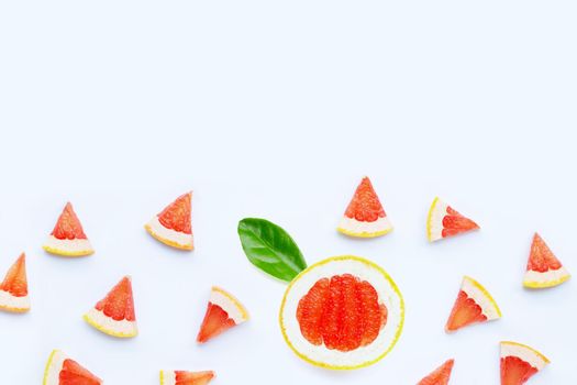 High vitamin C. Juicy grapefruit slices on white background.