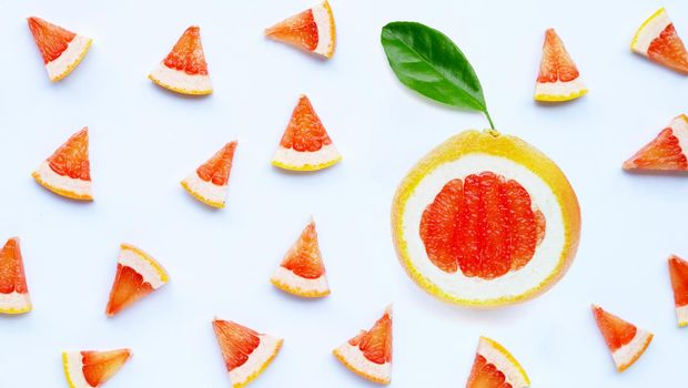 High vitamin C. Juicy grapefruit slices on white background.