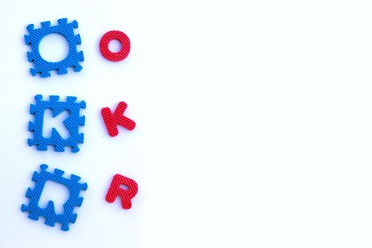 OKR puzzle alphabets on white background.