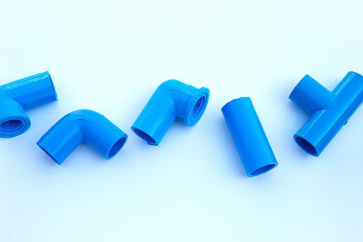 Blue pvc pipe connection isolated on white background.