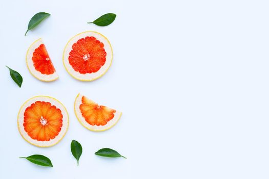 High vitamin C. Juicy grapefruit slices on white background.