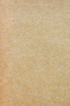 Sheet of brown paper or cardboard texture for background.