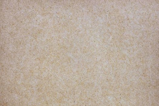Sheet of brown paper or cardboard texture for background.