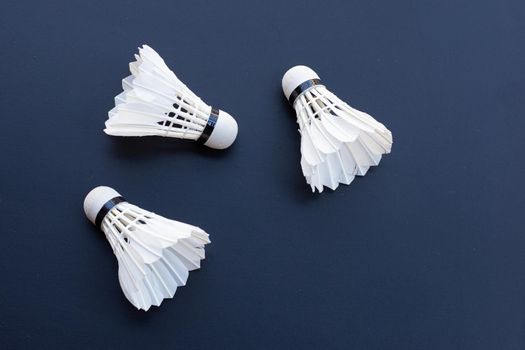 Shuttlecock or badminton balls on dark background.