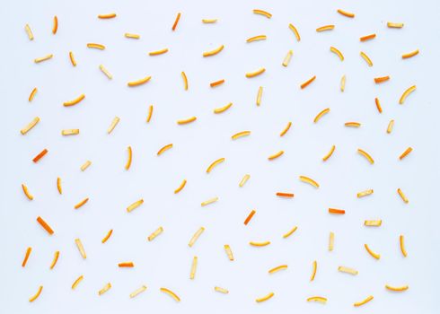 Orange peels on white background. top view