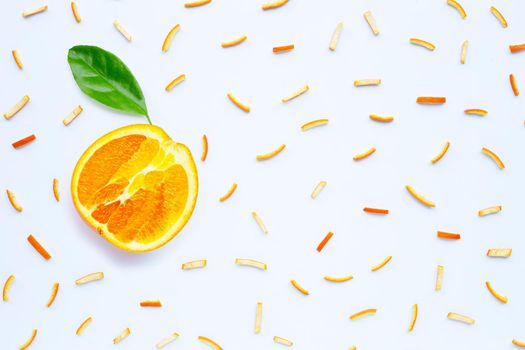 Orange peels on white background. top view