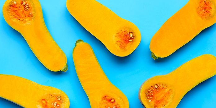 Butternut squash on blue background.