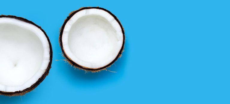 Coconuts on blue background. Top View