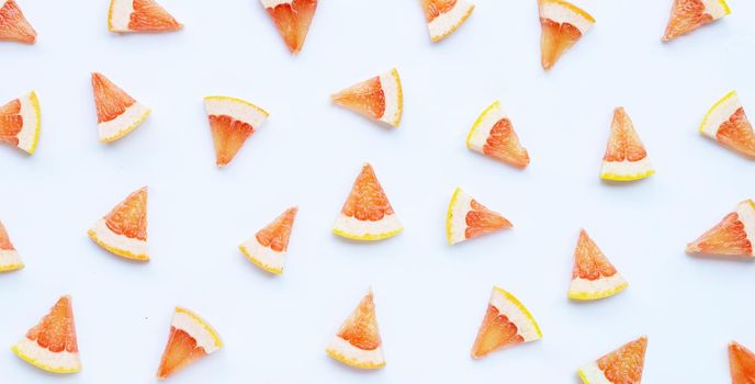 High vitamin C. Juicy grapefruit slices on white background.
