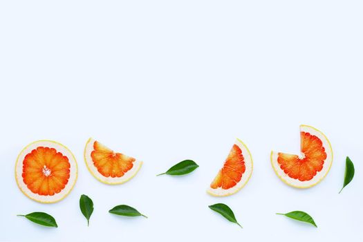 High vitamin C. Juicy grapefruit slices on white background.