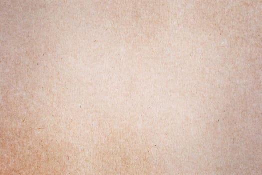 Sheet of brown paper or cardboard texture for background.
