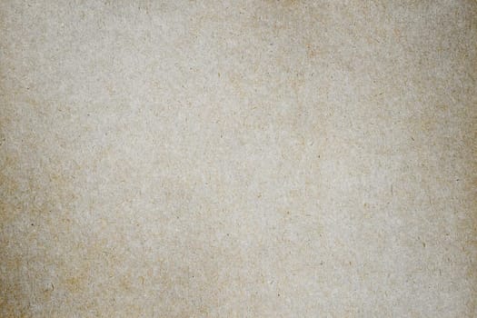 Sheet of brown paper or cardboard texture for background.
