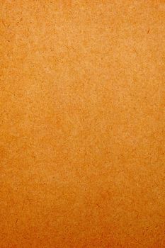 Sheet of brown paper or cardboard texture for background.