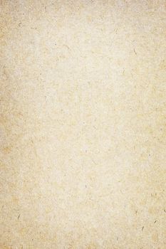 Sheet of brown paper or cardboard texture for background.