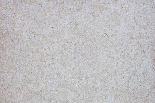 Sheet of brown paper or cardboard texture for background.