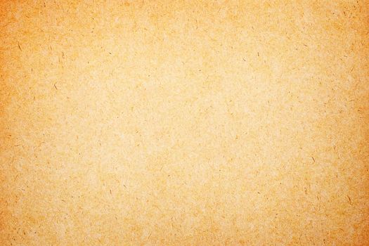 Sheet of brown paper or cardboard texture for background.