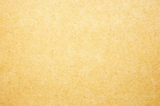 Sheet of brown paper or cardboard texture for background.