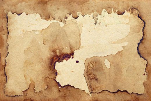 Old brown paper grunge background. Abstract frame liquid coffee color texture.