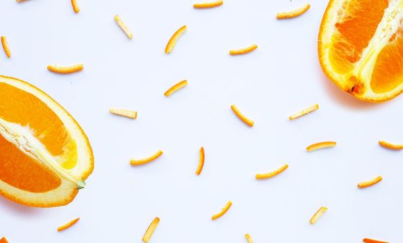 Orange fruit with peels on white background. top view