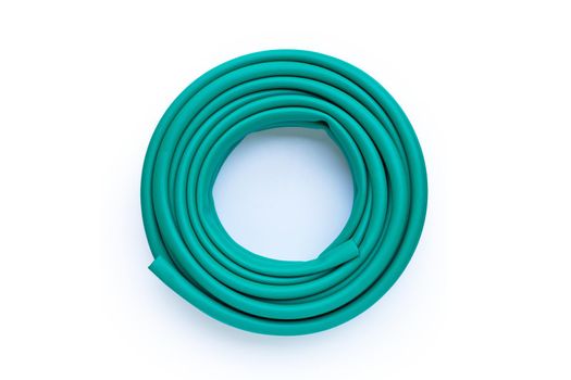 Green garden hose on white background.