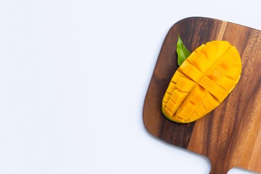 Tropical fruit, Mango on  cutting board on white background. Top view