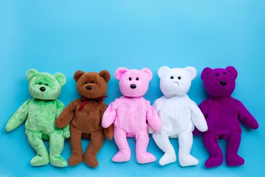 Toy bears on blue background.