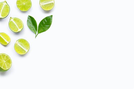 Limes with leaves isolated on white background.
