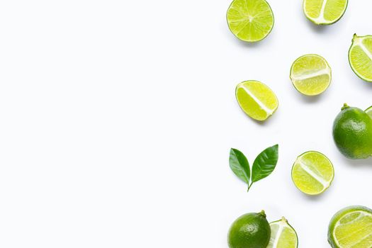 Limes with leaves isolated on white background.