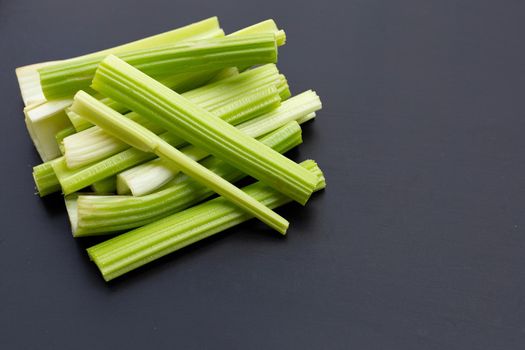 Fresh celery on dark background. Copy space