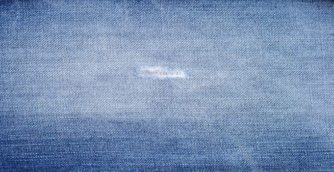 Close up of blue jeans texture for background.