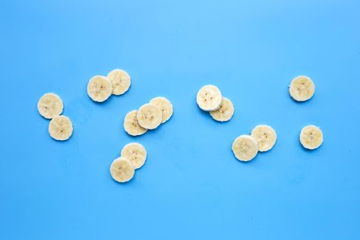Banana slices on blue background.