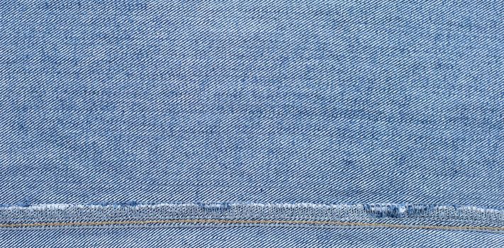 Close up of inside blue jeans texture background.