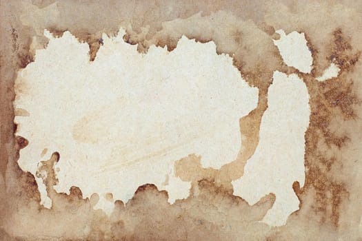 Old brown paper grunge background. Abstract frame liquid coffee color texture.