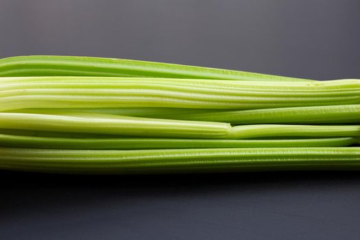 Fresh celery on dark background. 