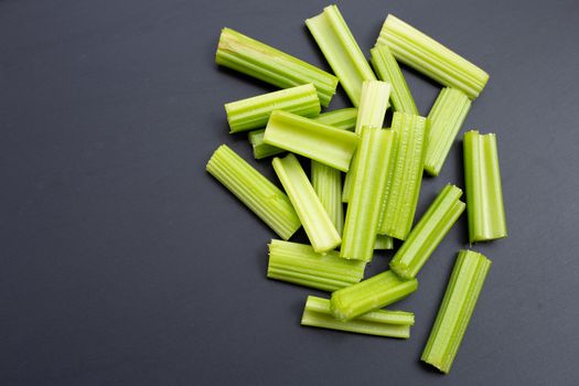 Fresh celery on dark background.