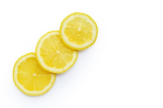 Fresh lemon slices isolated on white background.