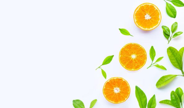 High vitamin C, Juicy and sweet. Fresh orange fruit with green leaves on white.