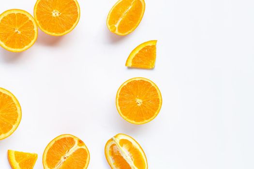 Frame made of fresh orange citrus fruit with leaves isolated on white background. Juicy and sweet