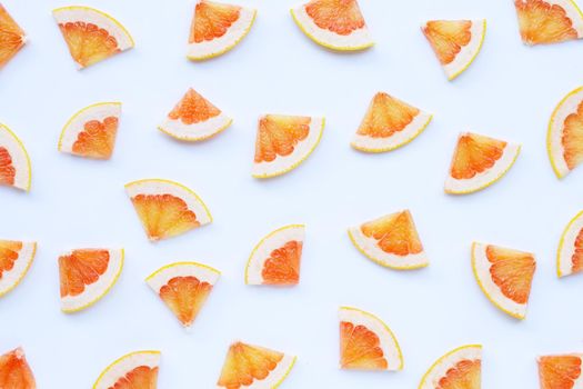 High vitamin C. Juicy grapefruit slices on white background.